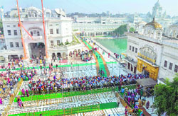 Devotees wait in a queue to pay obeisance at the Golden Temple on Thursday. a tribune photograph