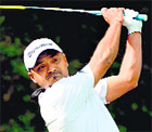 Rahil Gangjee tees-off during the first round of the Panasonic Open at the Delhi Golf Club on Thursday. AFP