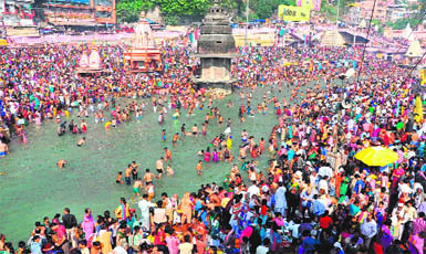 Devotees take a dip in the Ganga on the occasion of Kartik Purnima in Haridwar on Thursday 