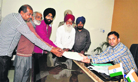Representatives of the residents submit a memorandum to the Deputy Commissioner in Amritsar on Friday.