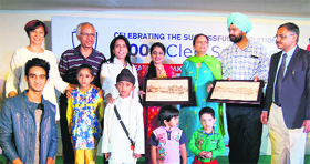 Dr Avtar Singh and his team with children, who were operated upon under the Smile project for cleft-lip and palate surgeries, in Amritsar on Friday.