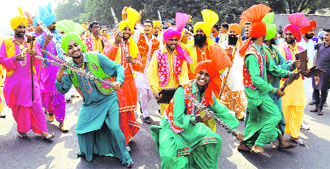 Artistes perform during the Virasat Mela procession in Bathinda on Friday.