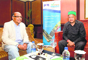 Chief Minister Virbhadra Singh meets chairman and managing director of Deccan Airways Capt Gopinath during the investors meet in Bengaluru on Friday
