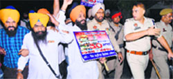Protesters raise slogans seeking justice for 84 riot victims. file photo