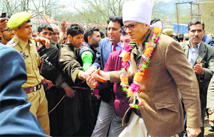National Conference working president Omar Abdullah shakes hands with people at a poll rally in Kashmir.