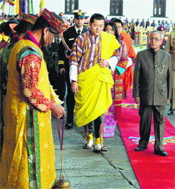 President Pranab Mukherjee with King of Bhutan Jigme Khesar Namgyel Wangchuck at Tashichhodzong in Thimpu, Bhutan, on Friday. Breaking protocol, the King and his wife received Mukherjee at the Paro Airport