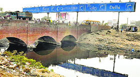 Stagnating sullage near the entrance of Greater Faridabad around Kheri village