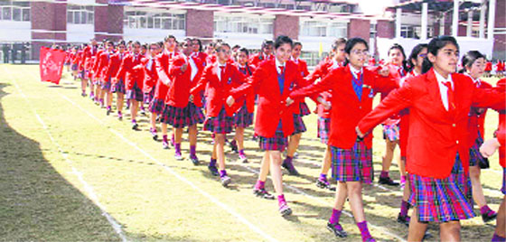 Students of Unison World School participate in a march past in the annual sports day function of the school in Dehradun on Friday. A Tribune photograph