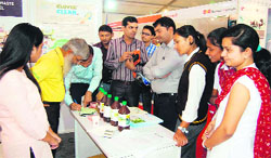 Industry delegates and college students have a look at products at the Industrial Expo organised by the CII at the Chinmay College ground in Haridwar on Friday. Tribune photo