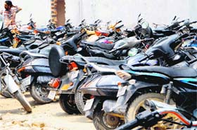 Visitors park two-wheelers illegally outside the district courts complex