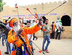 A nihang displays his skills during the Virasat Mela at Jaipalgarh village in Bathinda on Saturday