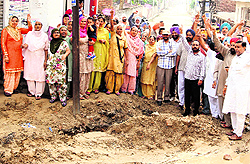 Residents protest on Ajit Road