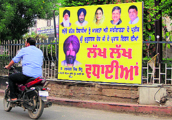 Contestants put up hoardings ahead of the MC elections in Ludhiana on Saturday