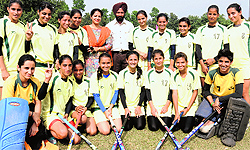 The team of GGS College for Women in a jubilant mood after winning a hockey tournament on Saturday