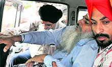 Maternal grandfather Balwinder Singh being taken to a hospital after he fainted during the cremation