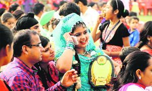 Holding the trophy of solo dance competition Euphoria 2014 in her hand, a girl in a jubilant mood at Innocent Hearts School in Jalandhar on Saturday.