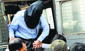 NIA officials produce Burdwan blast accused Zia-ul-Haque at a local court in Kolkata on Saturday.