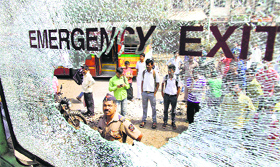 A vandalised vehicle in Thane on Saturday.