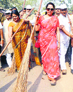BJP MP Hema Malini sweeps a road as she participates in Swachch Bharat Misson in Mathura on Saturday.