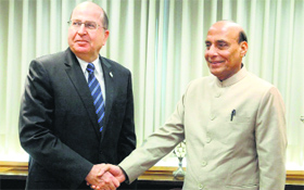 Home Minister Rajnath Singh shakes hands with Defence Minister of Israel Moshe Yaalon in Tel Aviv on Friday. He invited Israel to become a partner in the Make in India initiative in the Defence sector.