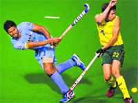 Rupinder Singh (L) passes the ball past Australias Flynn Ogilvie (R) during the third match of the four-match Test series in Perth on Saturday. AFP 