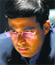 Viswanathan Anand looks up at his opponent, Magnus Carlsen, during the first game on Saturday.