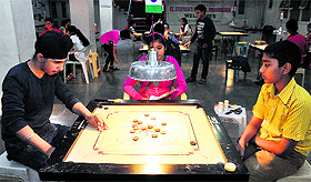 Gur Rehmat moves against Chirag during a carrom match at St Stephens School in Sector 45, Chandigarh, on Sunday. 