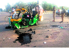 The mangled remains of the auto-rickshaw at the Shastri Nagar light point on Sunday.