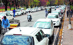 Vehicles parked alongside the road due to non-availability of space on the Panjab University campus in Chandigarh. 