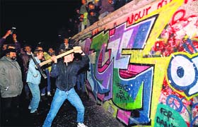 The Berlin Wall at the Brandenburg Gate on November 10, 1989. Pieces of the broken wall were displayed at museums later in London, New York and Paris
