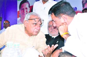 Former CM Bhupinder Singh Hooda addresses a workers meeting in Jhajjar on Sunday