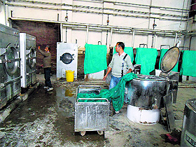 Lal Ded Hospital staff busy washing the bedding in Srinagar on Sunday.