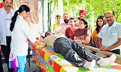 Volunteers donate blood during a camp in Ludhiana on Sunday