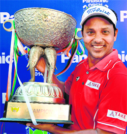 SSP Chowrasia with the trophy after winning the Panasonic Open India at the Delhi Golf Club in New Delhi on Sunday.