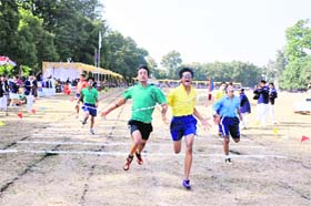 Students participate in a race during the annual sports meet of the St Josephs Academy in Dehradun on Sunday