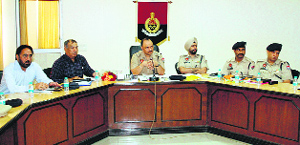 Police officials hold a meeting of members of the CPRC advisory board at Police Lines in Amritsar on Monday.