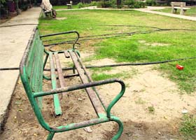 A damaged bench at a park in Namdev Nagar, Bathinda