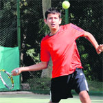 Shivam Vij returns a shot during a tennis match at Sector 10 in Chandigarh on Monday. Tribune photo: Pradeep Tewari