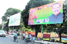 Celebration: After the elevation of BJP MP from Hoshiarpur Vijay Sampla as a Union Minister of State, party workers in Jalandhar have installed big hoardings of the leader in the city