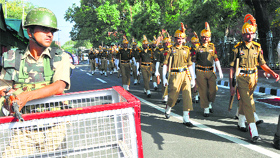 Security personnel keep a vigil outside the secretariat.