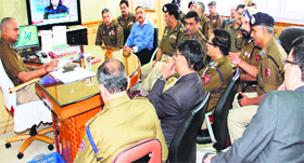 DGP K Rajendra Kumar holds a meeting of officials at the police headquarters in Jammu on Monday.