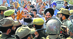 Retired employees of the State Road Transport Corporation hold a protest in Jammu on Monday.