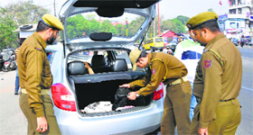 Security personnel search a vehicle in Jammu.
