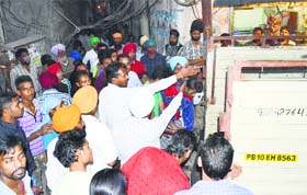 Residents shift victims to the hospital at the Manjit Nagar level crossing