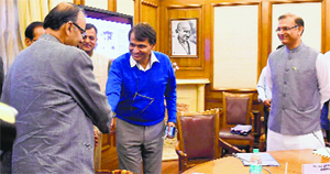 Finance Minister Arun Jaitley (left) shakes hands with Railways Minister Suresh Prabhu as MoS for Finance Jayant Sinha looks on in New Delhi on Monday.