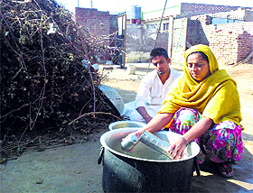 Sarbjit Kaur with her son at their house in Musa village, Mansa. Life has become a struggle for Sarbjit Kaur ever since her husband Rajwinder Singh committed suicide on November 6