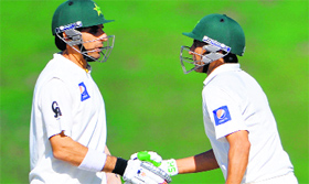 Misbah-ul-Haq and Younis Khan congratulate each other.