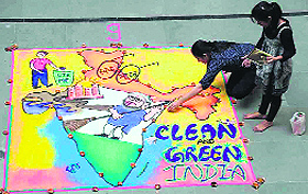 Students make rangoli during annual function at Uttaranchal University in Dehradun on Monday.