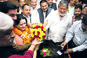 Congress candidate for the Rajya Sabha seat, Manorama Sharma Dobriyal, being felicitated by Chief Minister Harish Rawat after filing her nomination papers at the state Assembly in Dehradun on Monday.