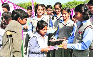 Students of RIMT World School celebrate National Education Day with differently abled children at General Hospital, Panchkula, on Tuesday.